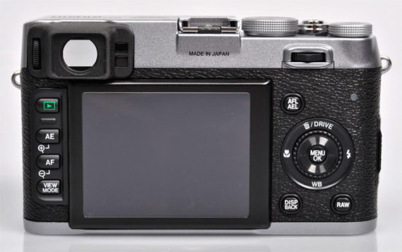Back view of X100 features the LCD screen surrounded by menu buttons and a dial.