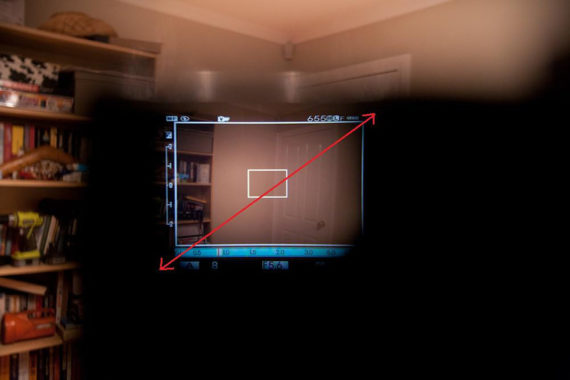 Fujifilm X100 viewfinder physical size features an image taken trough the viewfinder of the camera taken inside of a room for the purpose of showing how large is the viewing angle.